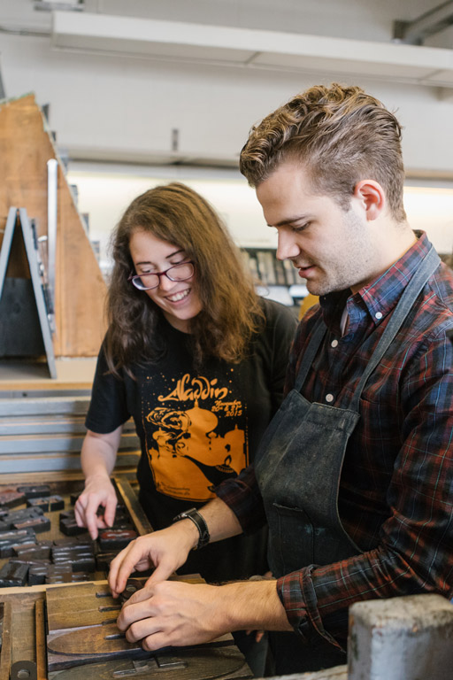 Students working with wood type.
