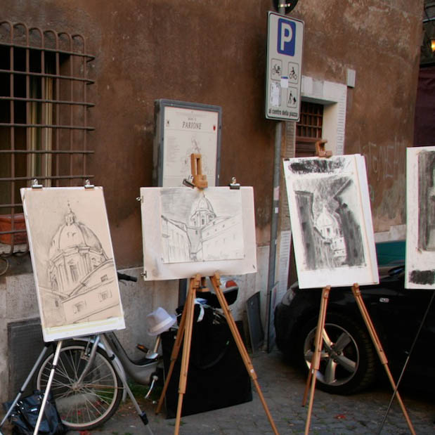 Drawings of architecture in front of a building.