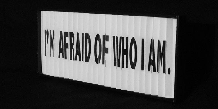 A sign that says "I'm afraid of who I am"