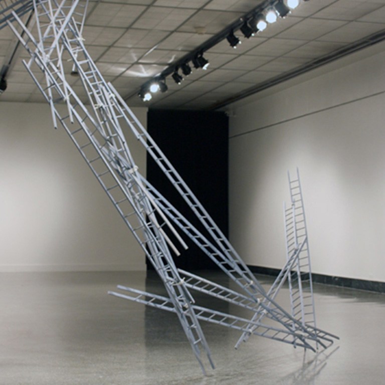 A sculpture using multiple ladders.