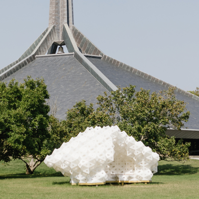 A white abstract outdoor sculpture