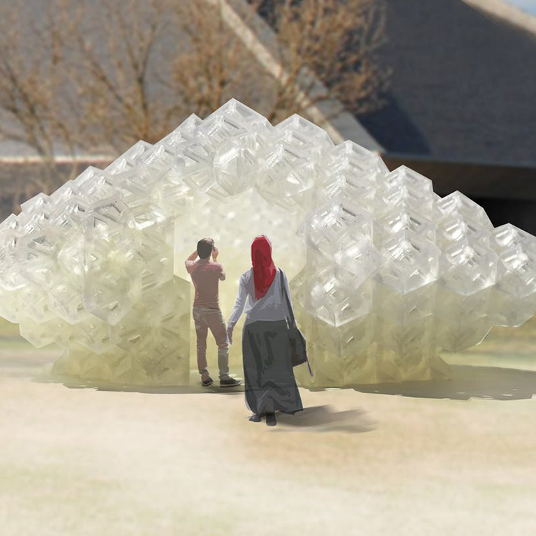 Two people stand in front of a large white abstract sculpture