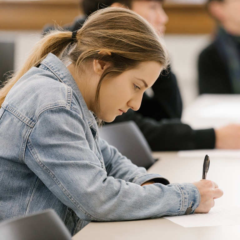 A student works on their paper.